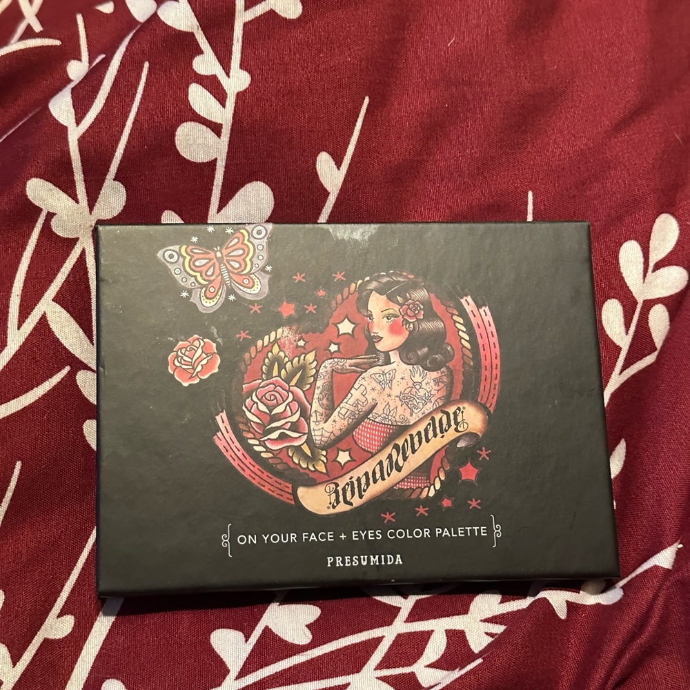 Raina Rebel eyeshadow palette new with plastic still on it never been touched